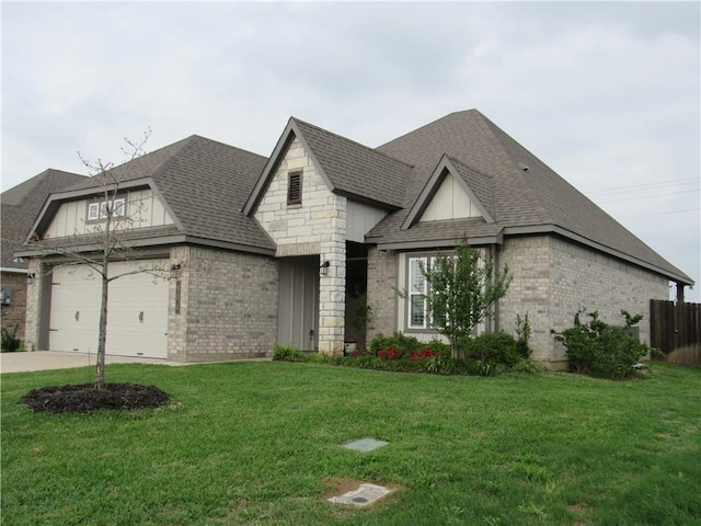 french country inspired facade with a front lawn, brick siding, an attached garage, a shingled roof, and driveway