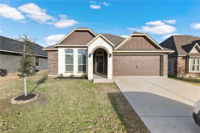 view of front of home with a garage and a front lawn