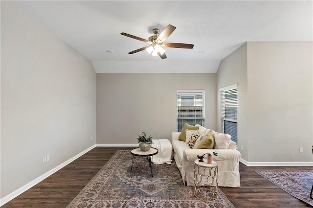 sitting room featuring ceiling fan, lofted ceiling, and dark wood-type flooring