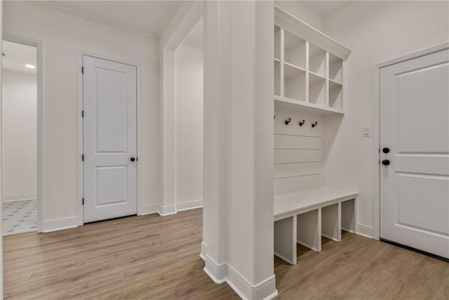 mudroom with light hardwood / wood-style flooring