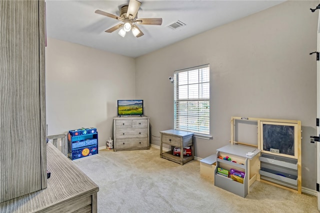 playroom featuring ceiling fan and carpet