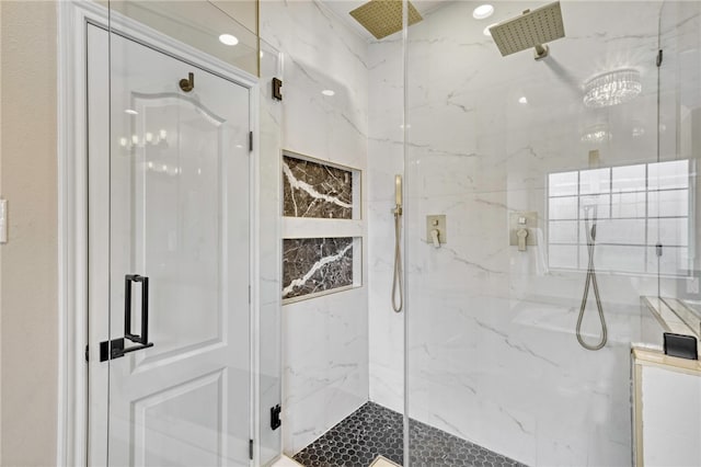 bathroom with a shower with door