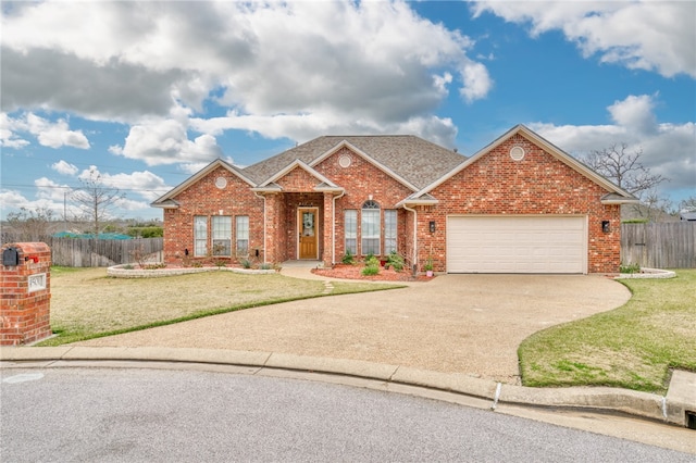 view of front of home with a garage and a front yard