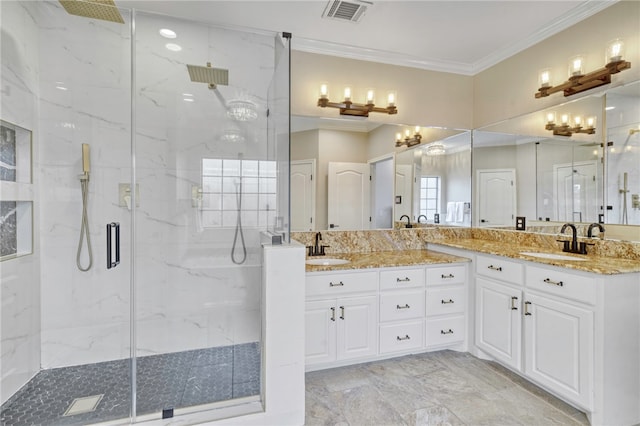 bathroom featuring vanity, crown molding, and a shower with shower door