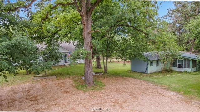 view of yard featuring a sunroom