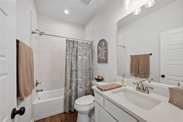 full bathroom featuring wood-type flooring, vanity, toilet, and shower / bath combo