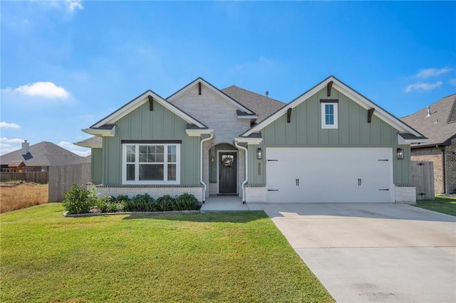 view of front of house featuring a front yard and a garage