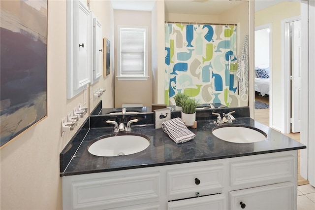 bathroom with double vanity and a sink