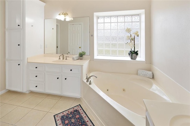 full bathroom featuring vanity, a whirlpool tub, and tile patterned floors