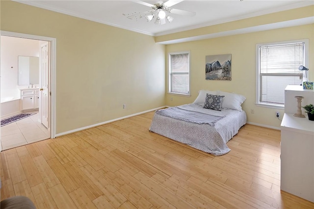 unfurnished bedroom featuring ornamental molding, light wood finished floors, multiple windows, and baseboards