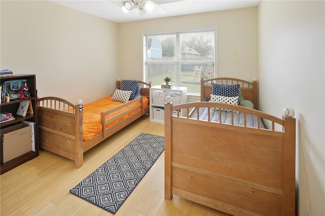 bedroom with wood finished floors