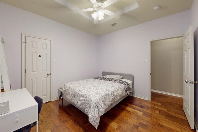 bedroom with wood-type flooring, baseboards, and ceiling fan
