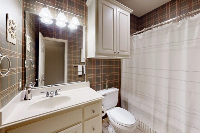 full bathroom with tile walls, toilet, vanity, and a shower with curtain