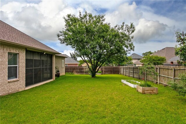 view of yard featuring a garden