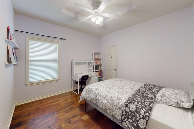 bedroom featuring wood-type flooring, baseboards, and a ceiling fan