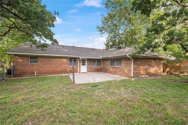 1202 Berkeley St, College Station, TX 77840 - rear view of property featuring a patio, brick siding, and a shingled roof