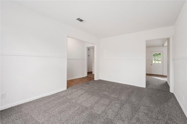 1202 Berkeley St, College Station, TX 77840 - spare room with carpet flooring and wainscoting