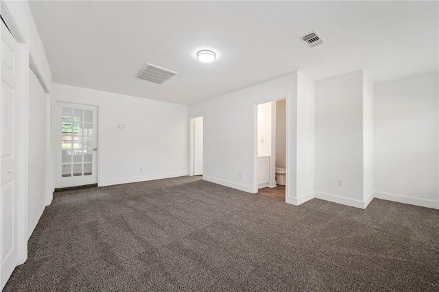 1202 Berkeley St, College Station, TX 77840 - unfurnished room with dark colored carpet and baseboards