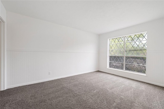 1202 Berkeley St, College Station, TX 77840 - carpeted empty room featuring a wainscoted wall