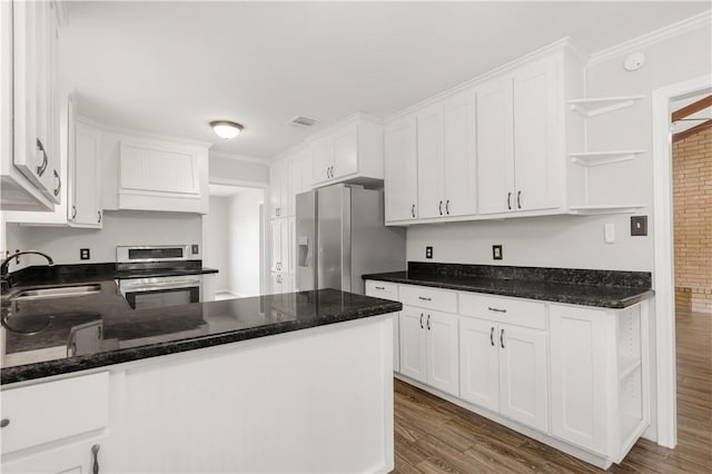 3614 Oak Ridge Dr, Bryan, TX 77802 - kitchen featuring stainless steel appliances, open shelves, white cabinetry, wood finished floors, and crown molding