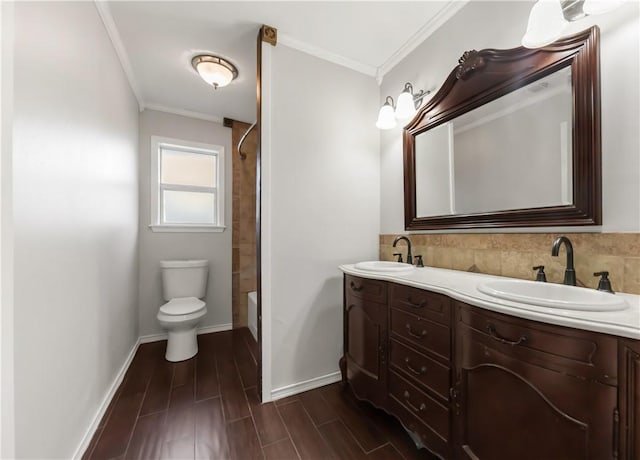 3614 Oak Ridge Dr, Bryan, TX 77802 - bathroom featuring ornamental molding, double vanity, bathtub / shower combination, and wood finished floors