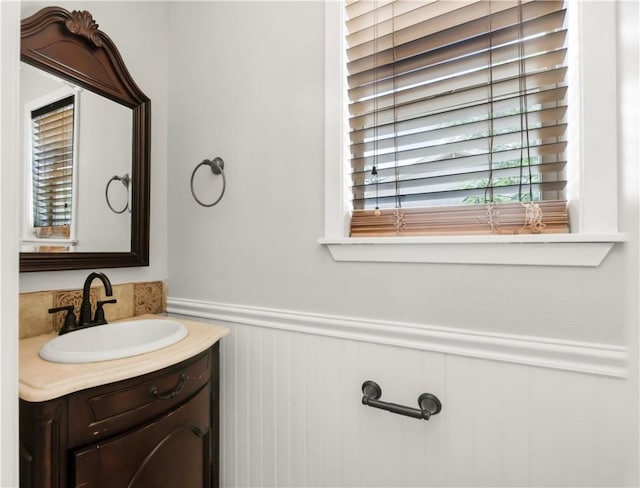3614 Oak Ridge Dr, Bryan, TX 77802 - bathroom with vanity and a wainscoted wall