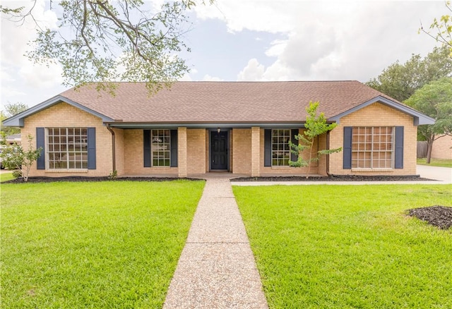 3614 Oak Ridge Dr, Bryan, TX 77802 - single story home featuring brick siding, a front lawn, roof with shingles, and a porch