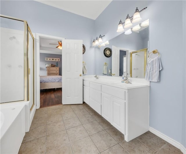 ensuite bathroom featuring double vanity, ensuite bath, tile patterned flooring, and a shower stall