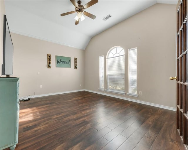 unfurnished room with dark wood finished floors, visible vents, vaulted ceiling, and baseboards