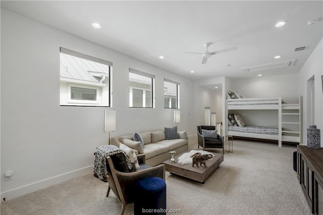 bedroom featuring ceiling fan and light carpet