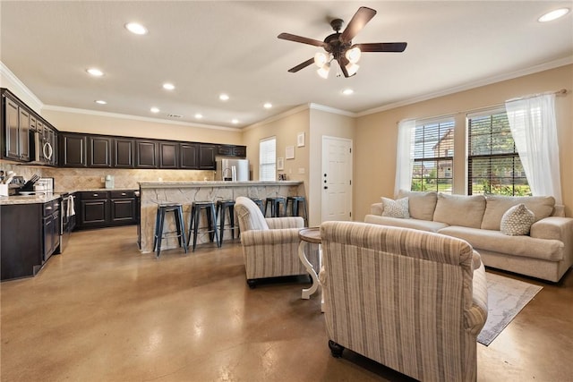 3015 Towers Pkwy, College Station, TX 77845 - living room featuring finished concrete floors, recessed lighting, ceiling fan, and crown molding