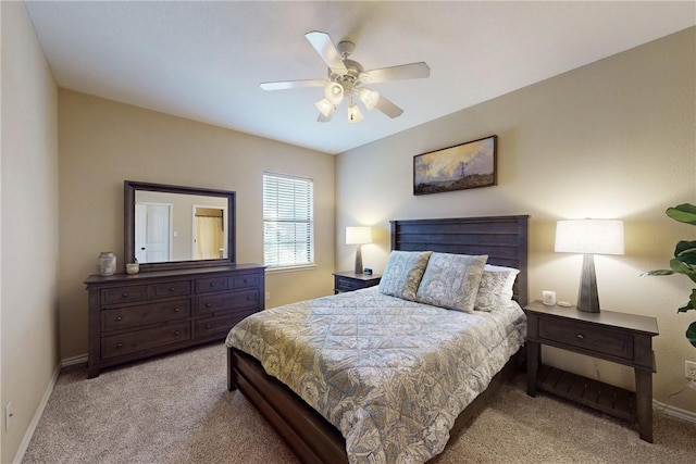 bedroom featuring ceiling fan and light carpet