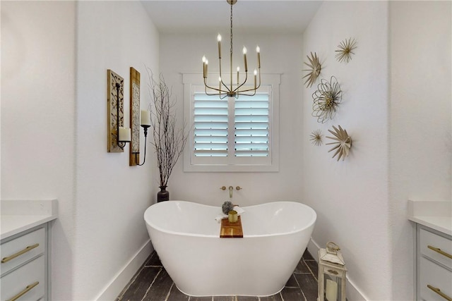 1981 County Road 202, Caldwell, TX 77836 - bathroom with vanity, a chandelier, a freestanding bath, and baseboards