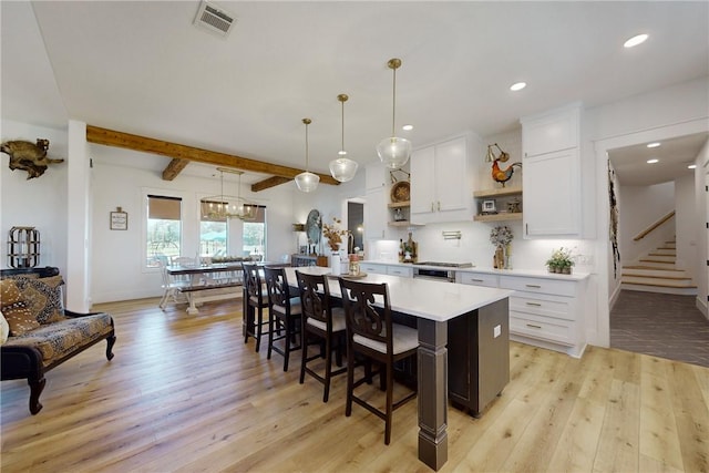 1981 County Road 202, Caldwell, TX 77836 - kitchen featuring open shelves, light wood-style flooring, light countertops, white cabinetry, and recessed lighting
