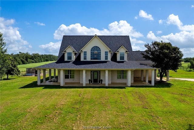 farmhouse featuring a patio area and a front yard