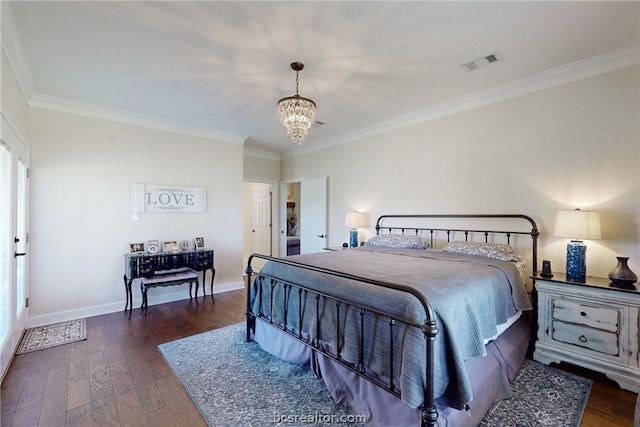 bedroom with crown molding, dark hardwood / wood-style flooring, and a notable chandelier