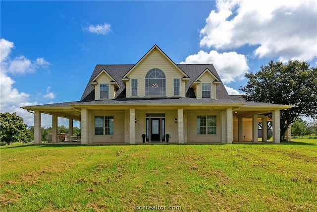 rear view of house with a yard