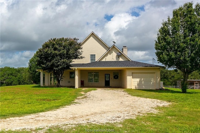 view of front facade with a garage and a front lawn