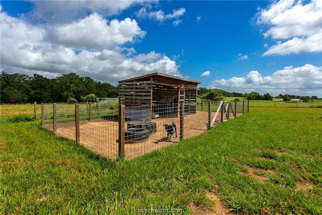 view of outdoor structure with a rural view