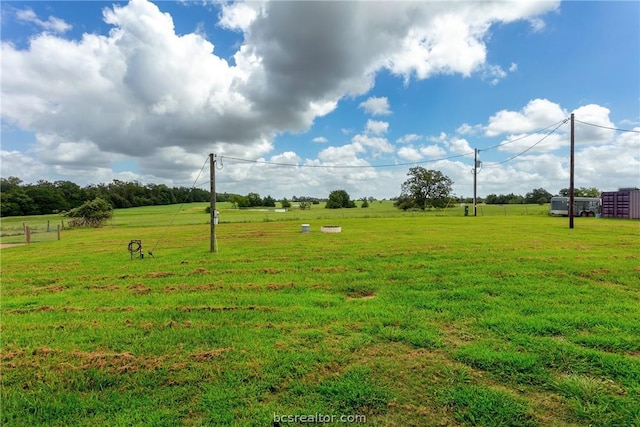 view of yard with a rural view