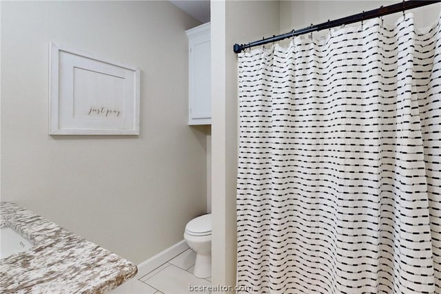 bathroom featuring tile patterned flooring, a shower with curtain, and toilet