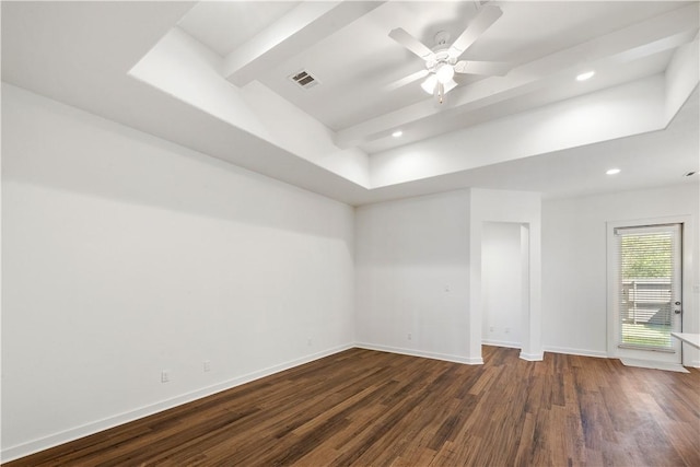 unfurnished room with beamed ceiling, dark hardwood / wood-style floors, and ceiling fan