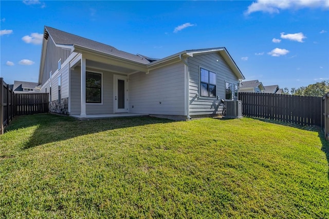 view of home's exterior featuring central air condition unit and a lawn