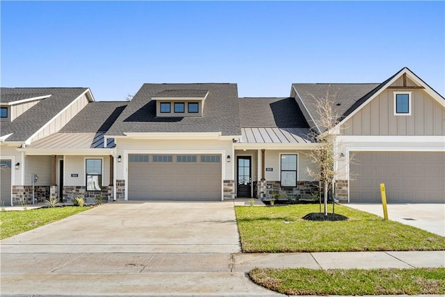 craftsman-style house with a front yard and a garage