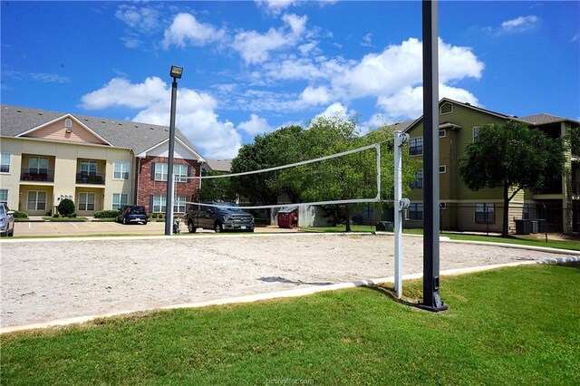 801 Luther St W Unit 1407, College Station, TX 77840 - view of community with volleyball court and a yard