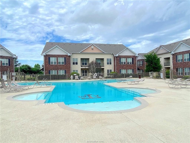 801 Luther St W Unit 1407, College Station, TX 77840 - community pool featuring a patio