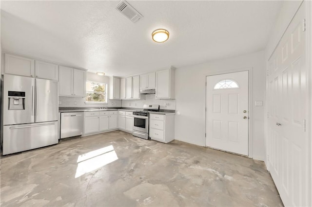 kitchen with backsplash, white cabinetry, a textured ceiling, and appliances with stainless steel finishes