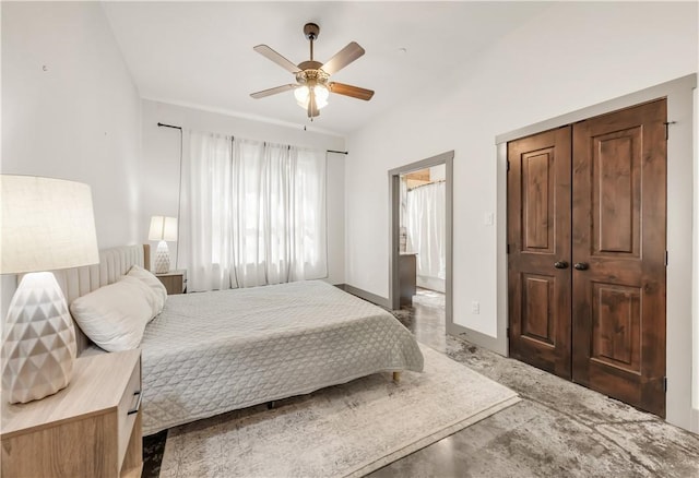 bedroom with a ceiling fan and baseboards