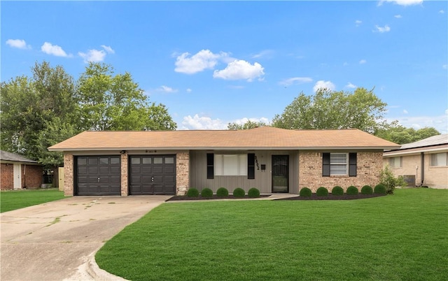 3802 Tanglewood Dr, Bryan, TX 77802 - ranch-style house featuring concrete driveway, an attached garage, a front yard, and brick siding