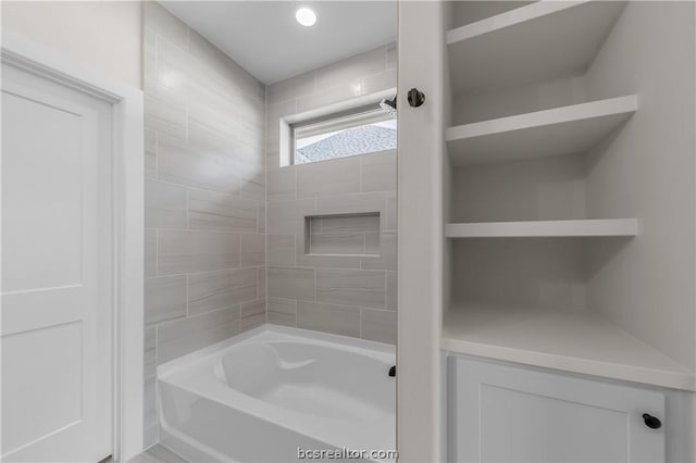 bathroom with washtub / shower combination